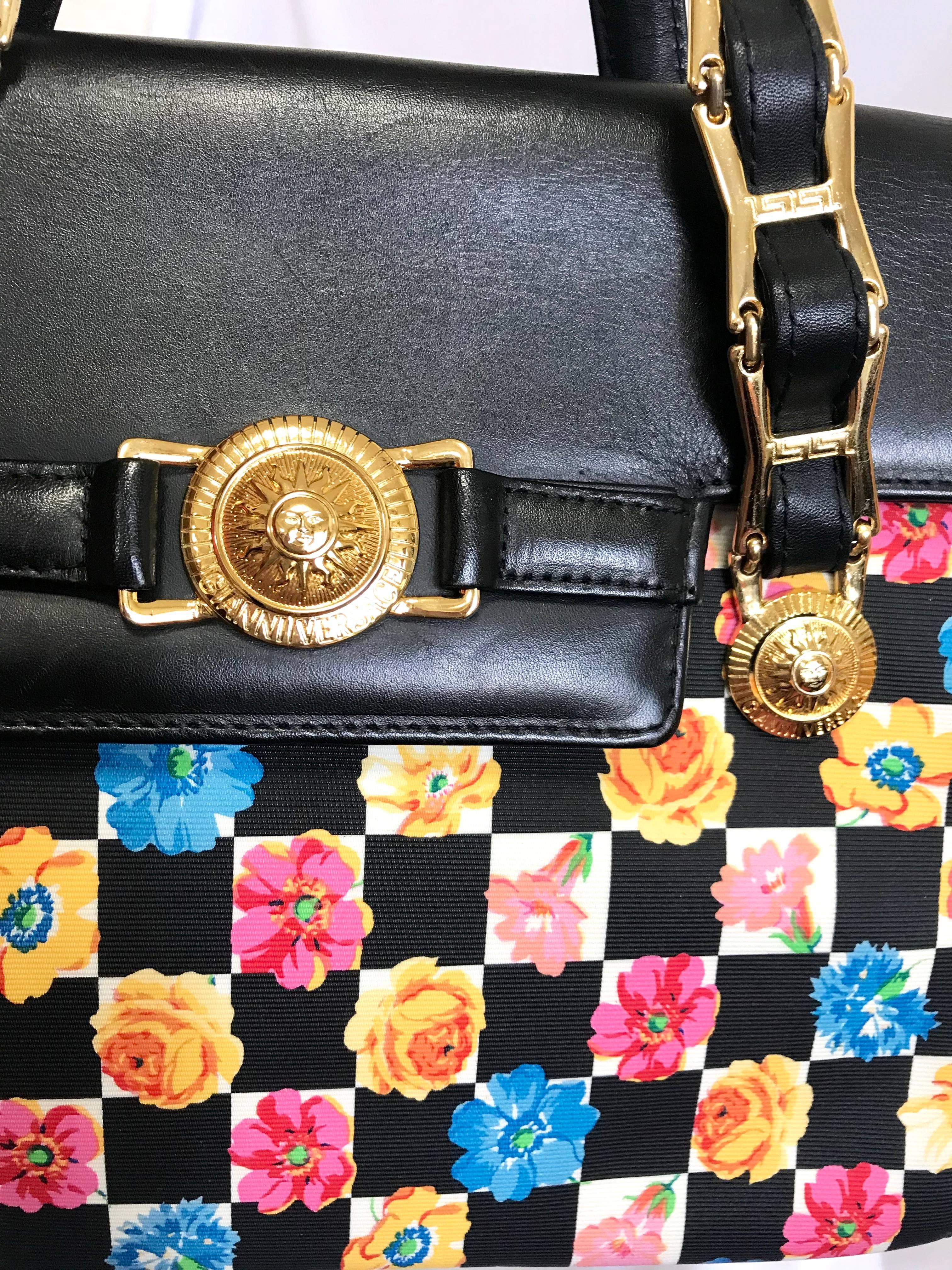 Women's Vintage Gianni Versace black leather and pink, orange, and blue flower prints. For Sale