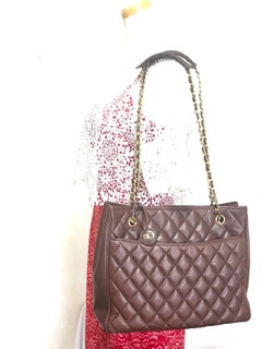 Vintage CHANEL brown quilted lamb leather classic tote bag with golden chains.