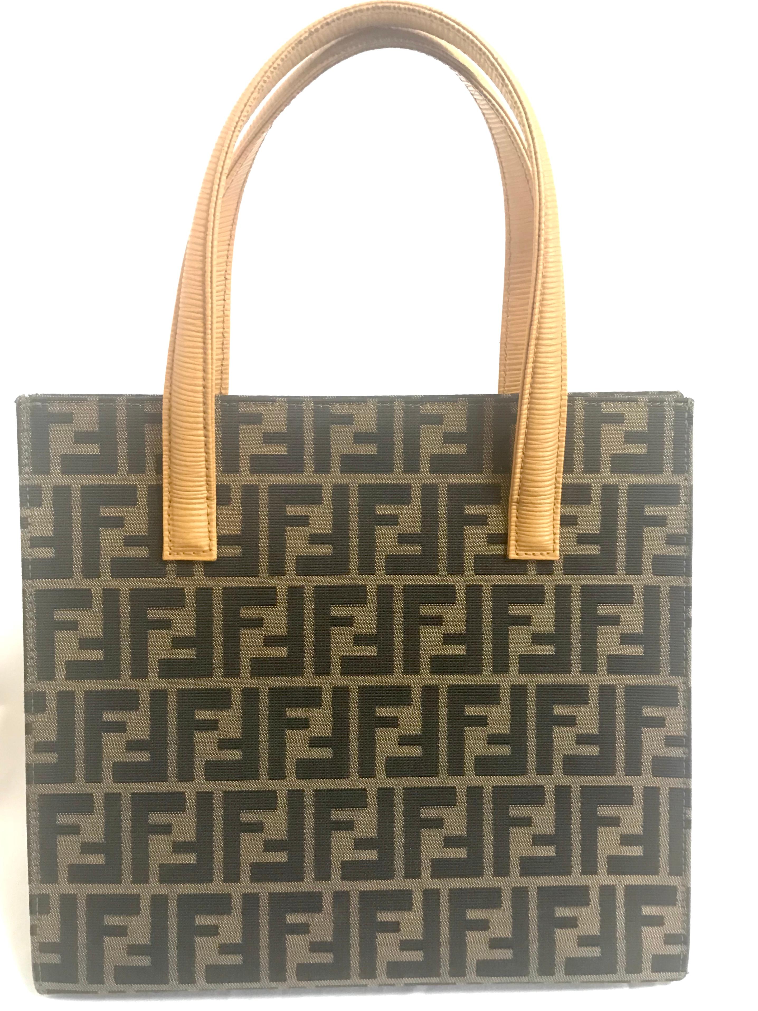1990s. Vintage FENDI classic logo zukka jacquard and mustard yellow epi leather tote bag with golden closure at front.

If you are a FENDI vintage collector and lover, then this one will be your must-have piece.

This is a vintage one-of-a-kind