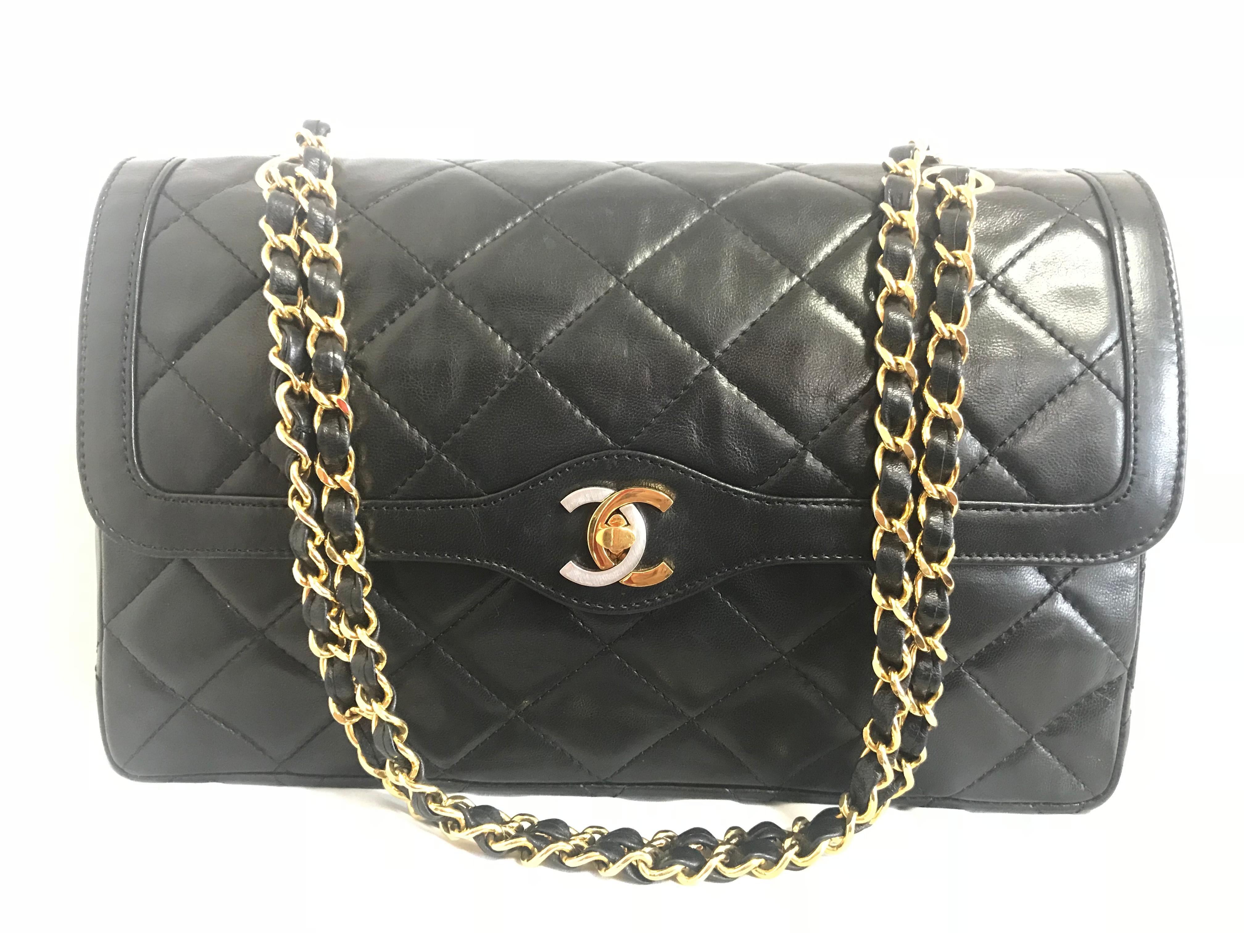 1980s. Vintage Chanel black lamb leather 2.55 classic double flap chain shoulder bag with gold and silver CC motif. Paris limited edition. 11