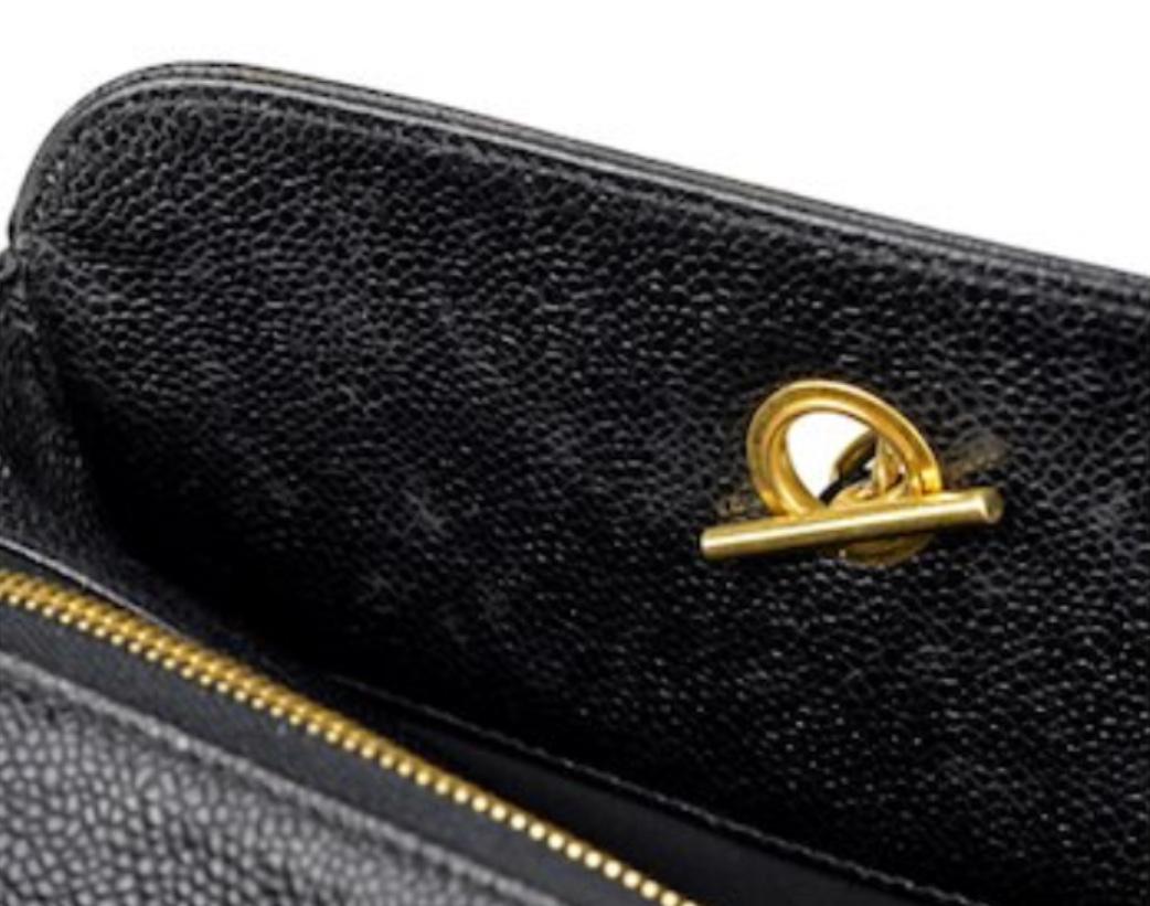 Black Vintage CHANEL black caviar leather Overnighter, Weekender bag, large chain bag.