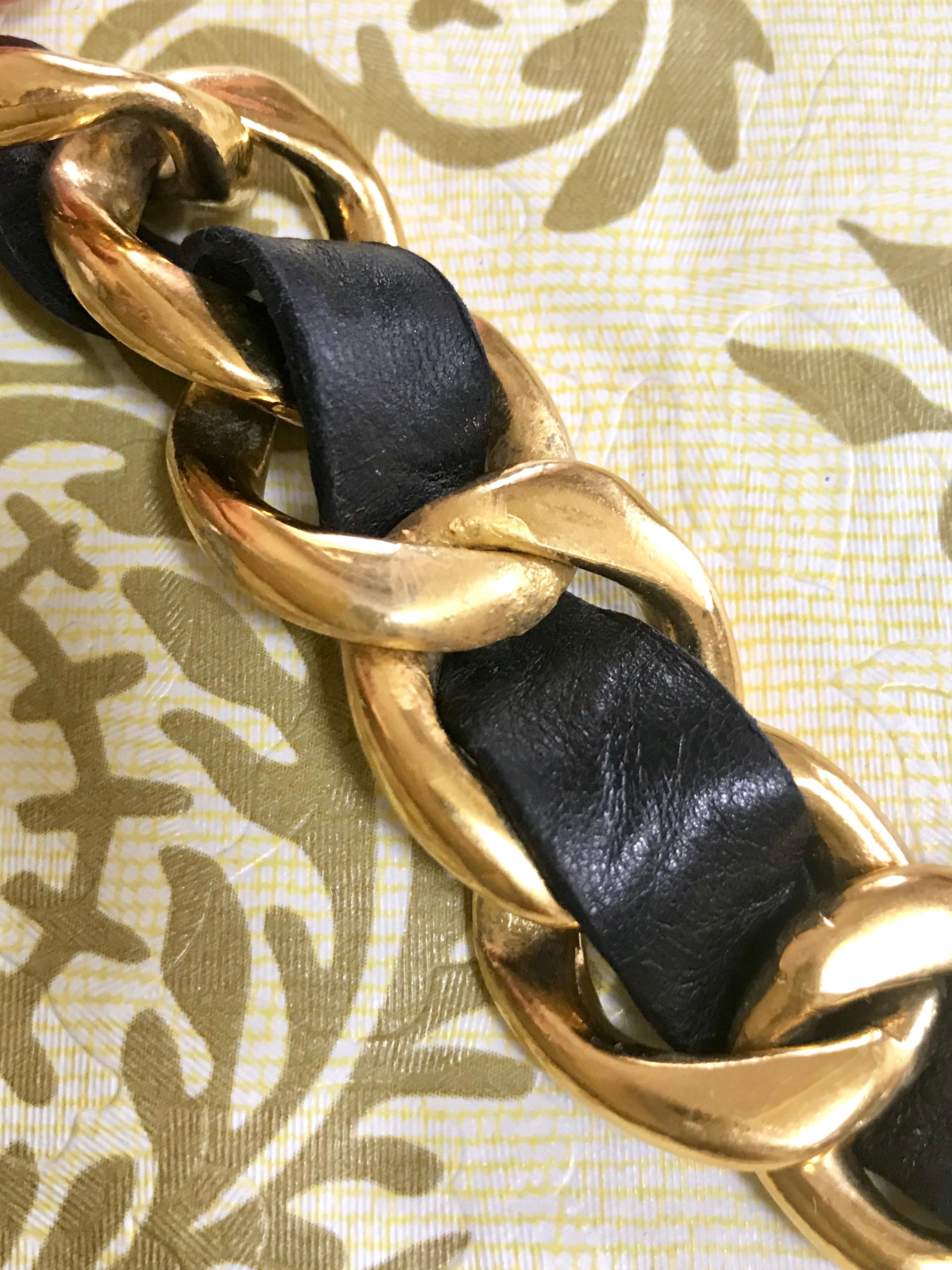 Women's Vintage CHANEL black leather thick chain belt with golden CC and mademoiselle. For Sale