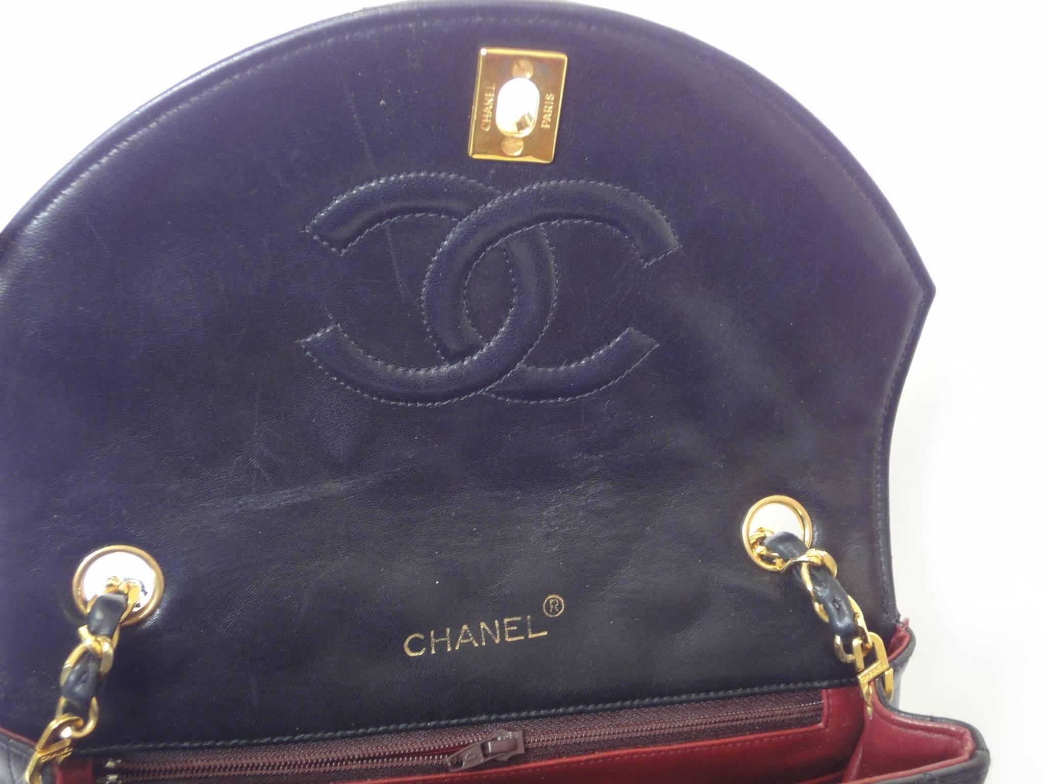 1980s vintage Chanel black lamb leather 2.55 classic oval flap shoulder bag. 2