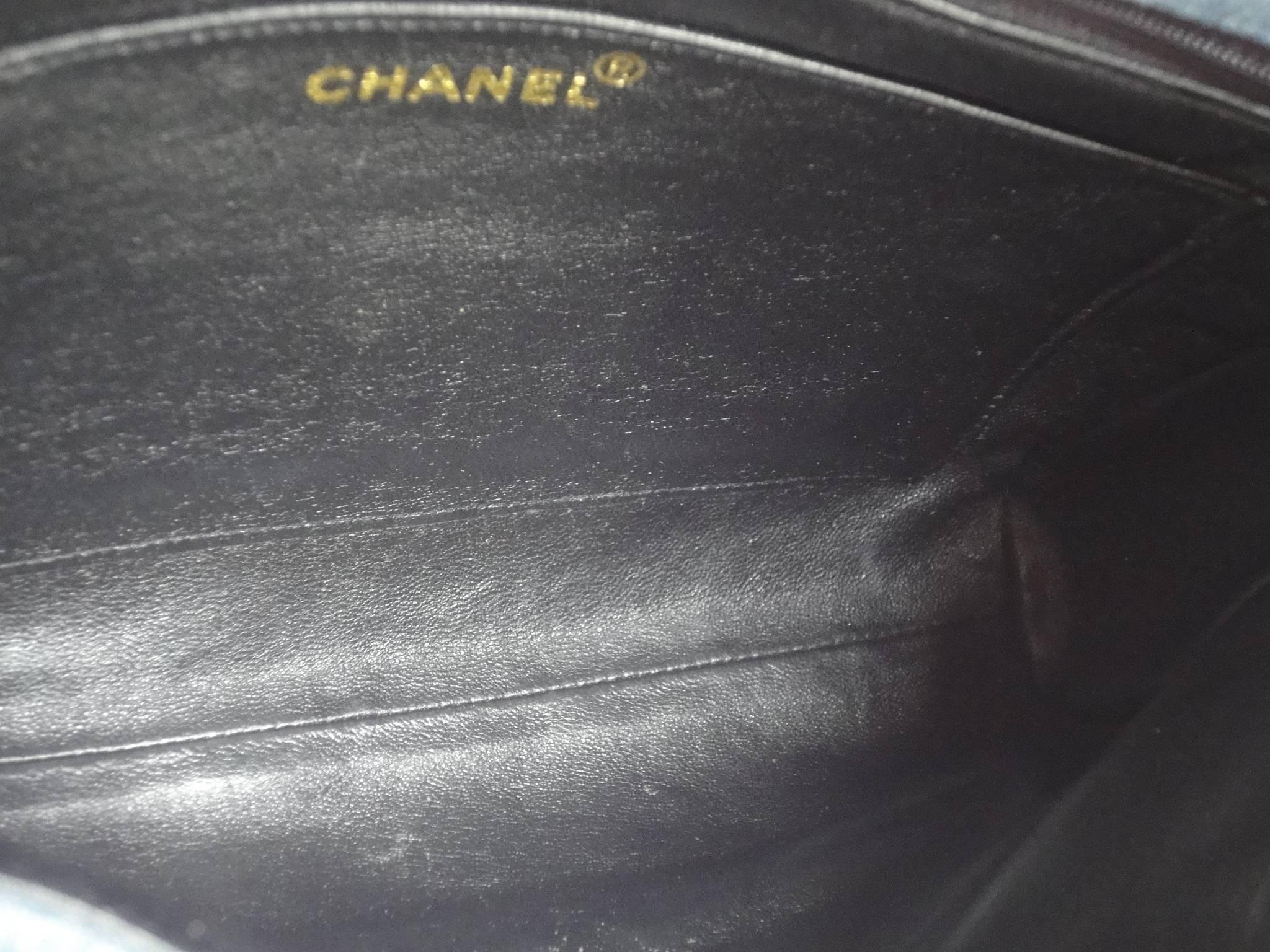 Vintage CHANEL denim bag with golden cc closure and vertical stitches.  2