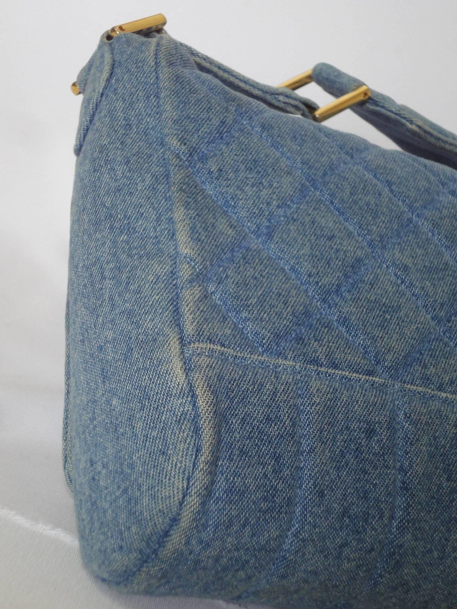 Vintage CHANEL denim bag with golden cc closure and vertical stitches.  1