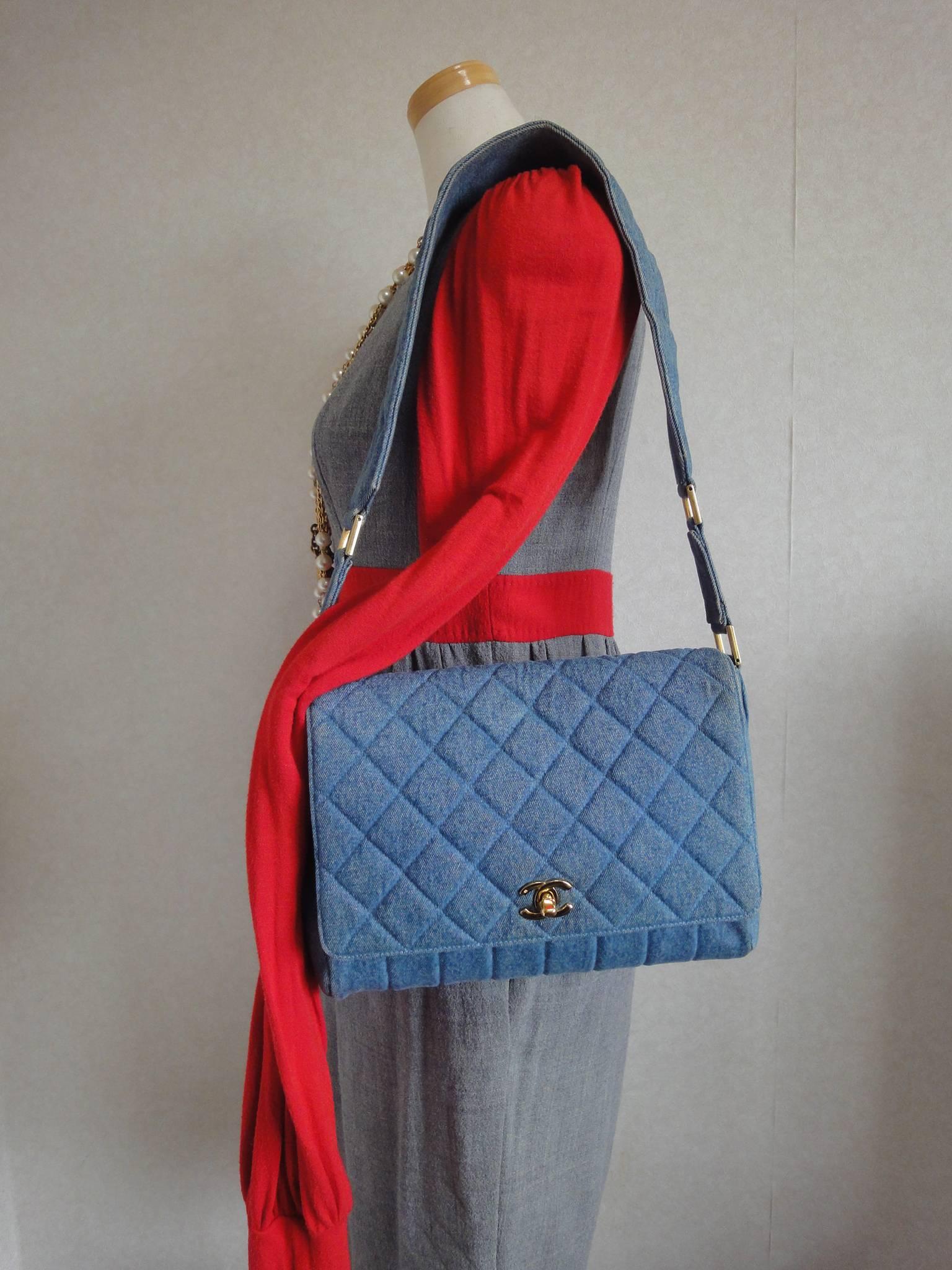 Vintage CHANEL denim bag with golden cc closure and vertical stitches.  4
