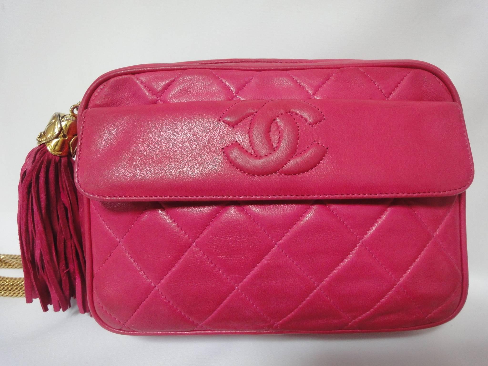 Vintage CHANEL pink lambskin camera bag style jewelry chain shoulder purse with a tassel and CC mark. Rare masterpiece.

Introducing one-of-a-kind, rare vintage purse from CHANEL back in the early 90's.
Vintage lambskin pink camera bag style
