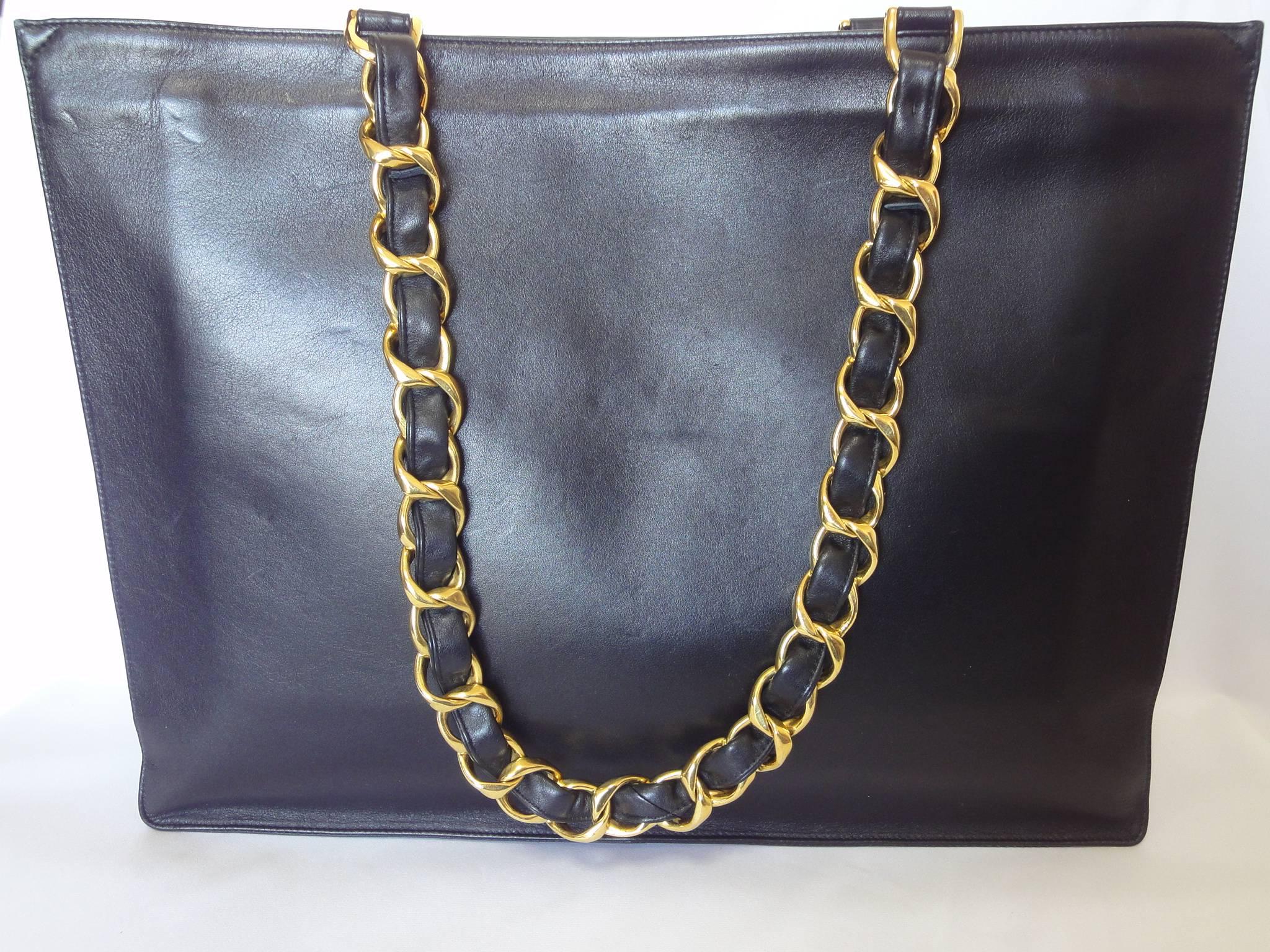 Black Vintage CHANEL black calfskin large tote bag with gold tone chain handles and CC