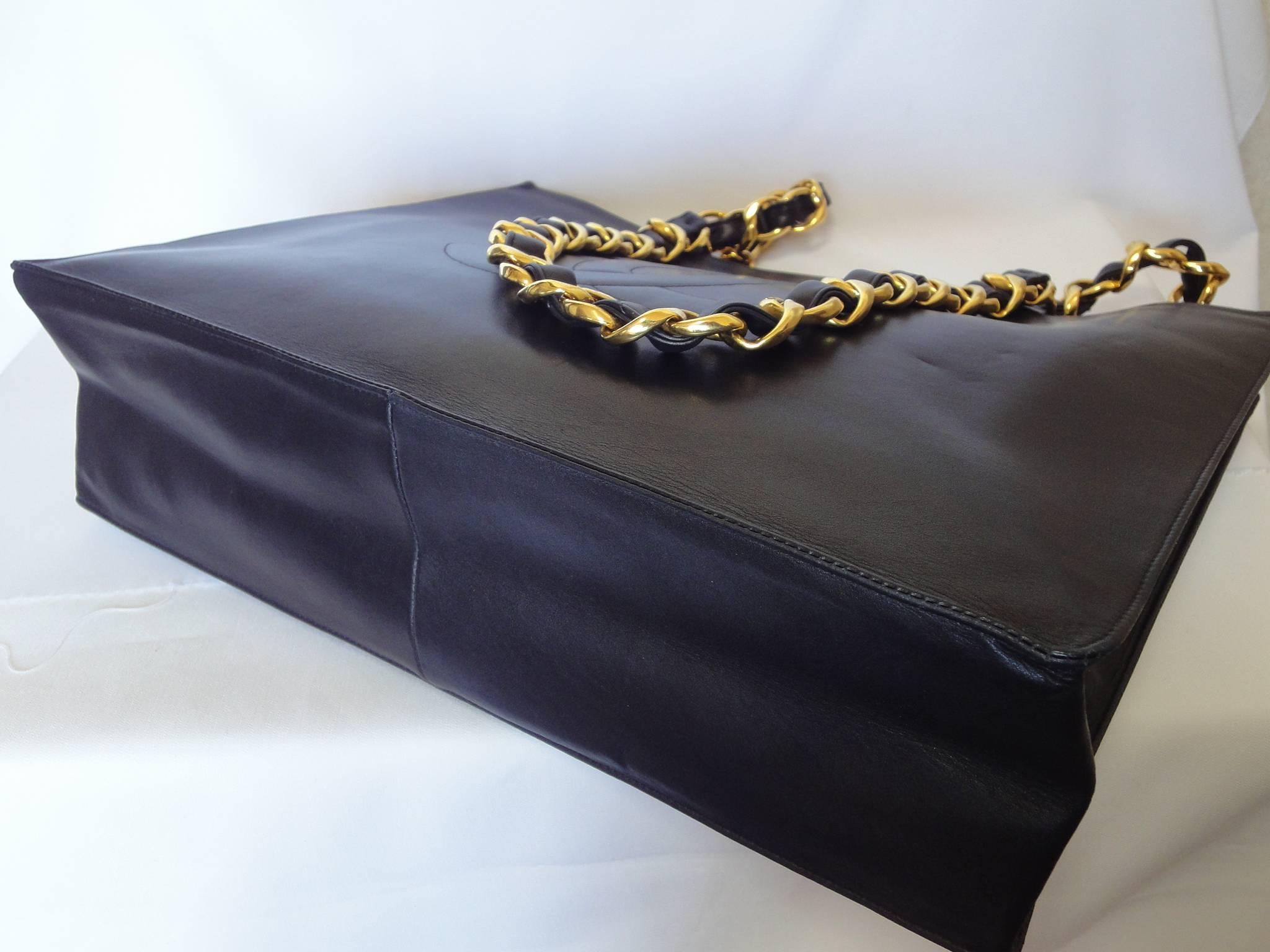 Women's or Men's Vintage CHANEL black calfskin large tote bag with gold tone chain handles and CC