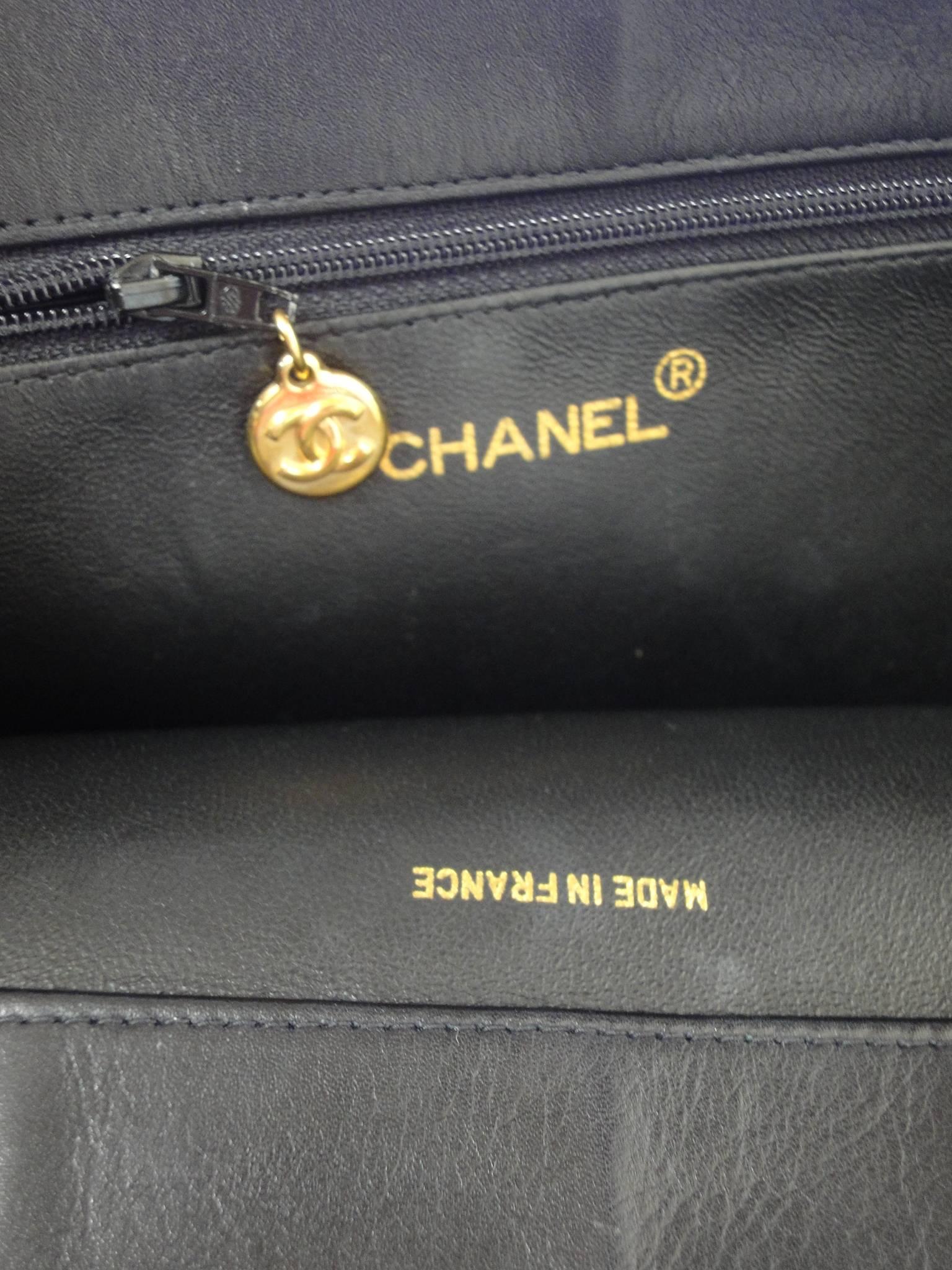 Vintage CHANEL black calfskin large tote bag with gold tone chain handles and CC 2