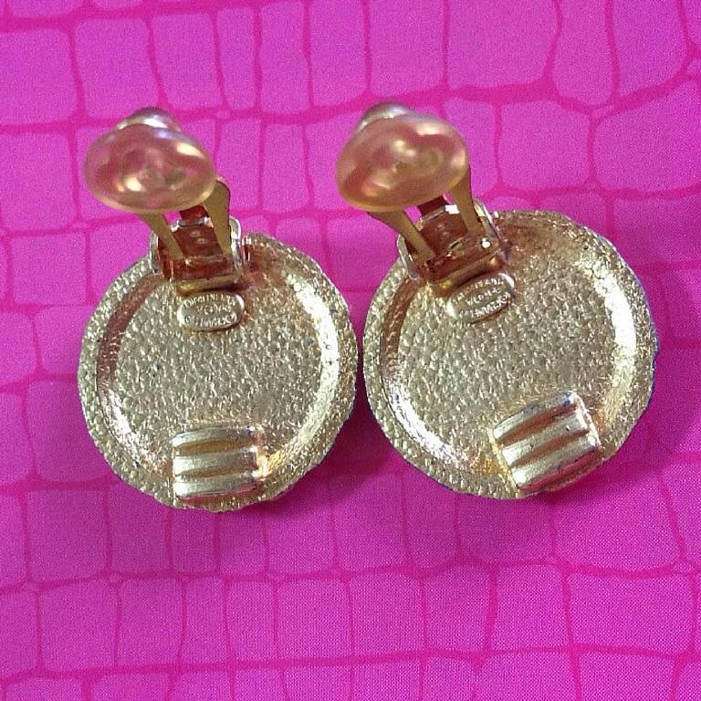 Women's 1990s Vintage CHANEL gold tone teardrop petal motif flower shape logo earrings. 