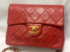 Vintage CHANEL lipstick red lambskin purse with golden CC and chain strap.