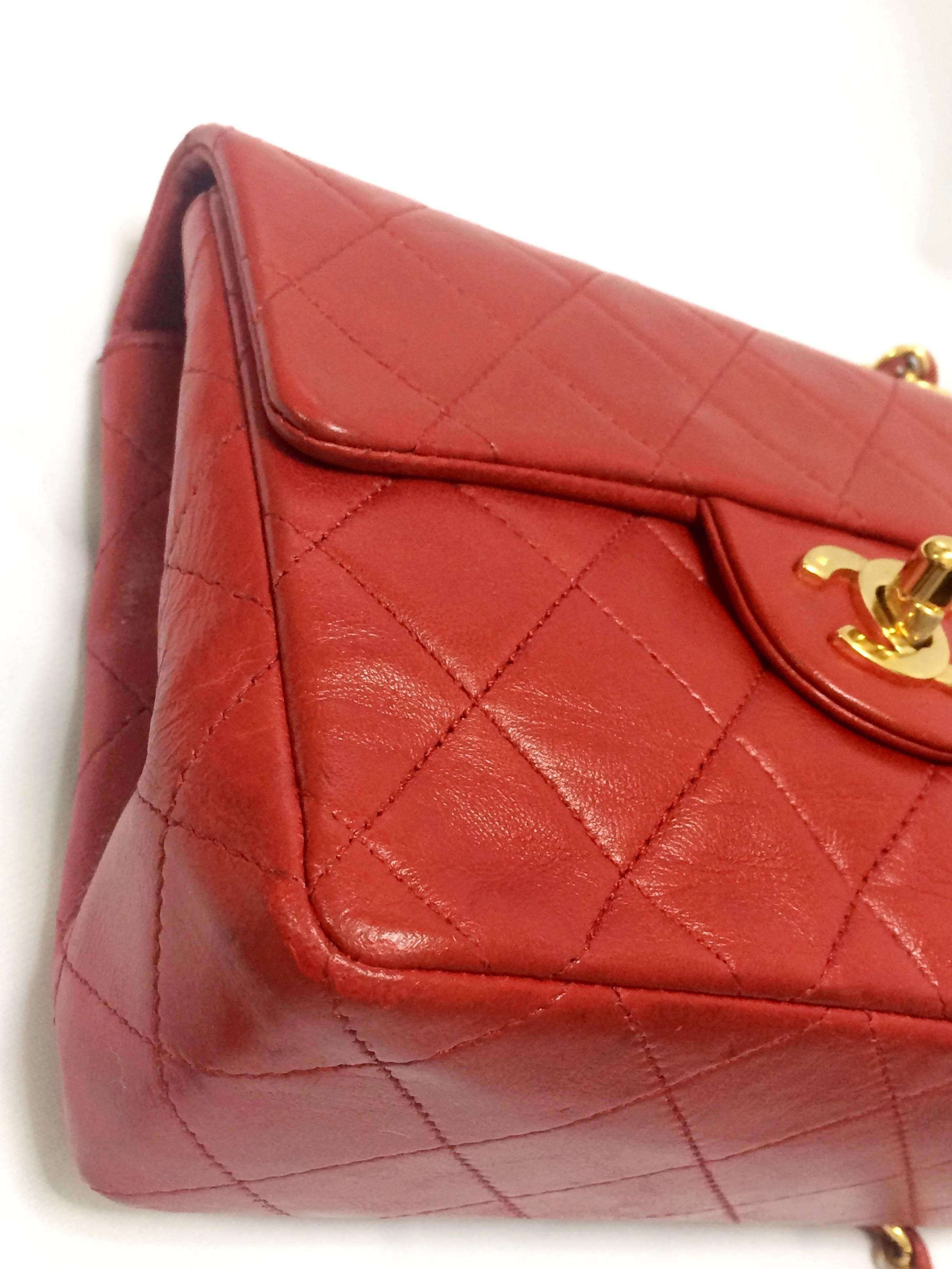 Women's Vintage CHANEL lipstick red lambskin purse with golden CC and chain strap.