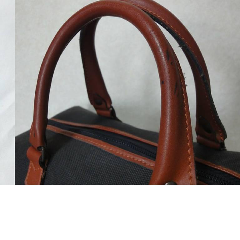 Vintage Yves Saint Laurent charcoal grey canvas and brown leather mini duffle ba For Sale 1