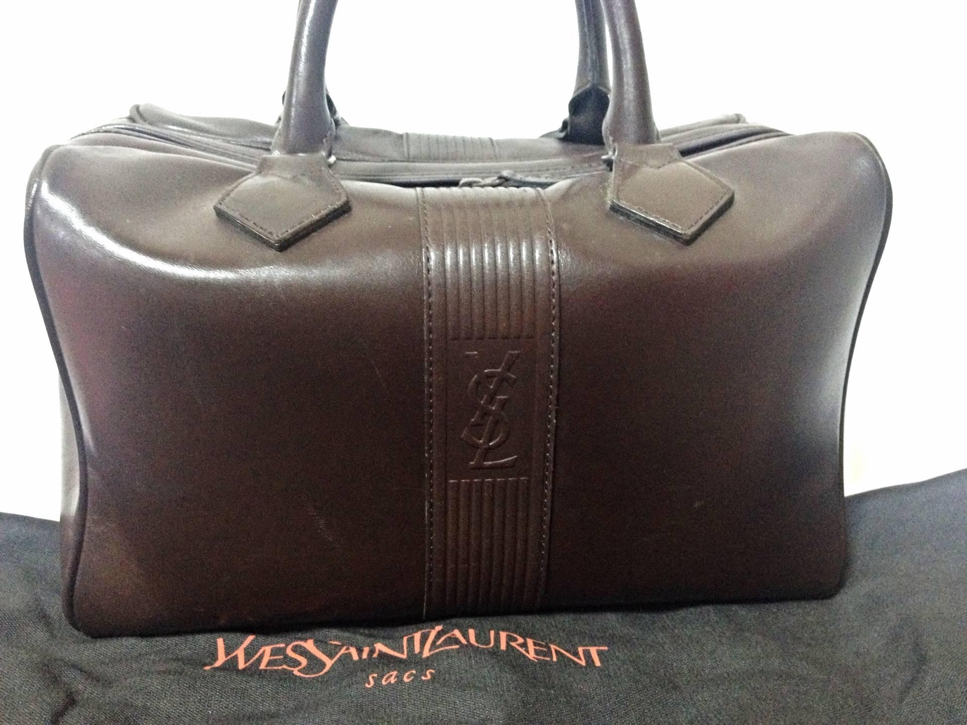 Vintage Yves Saint Laurent genuine dark brown leather daily use duffle bag. Clas For Sale 1