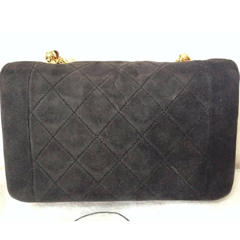 black suede bag with gold chain