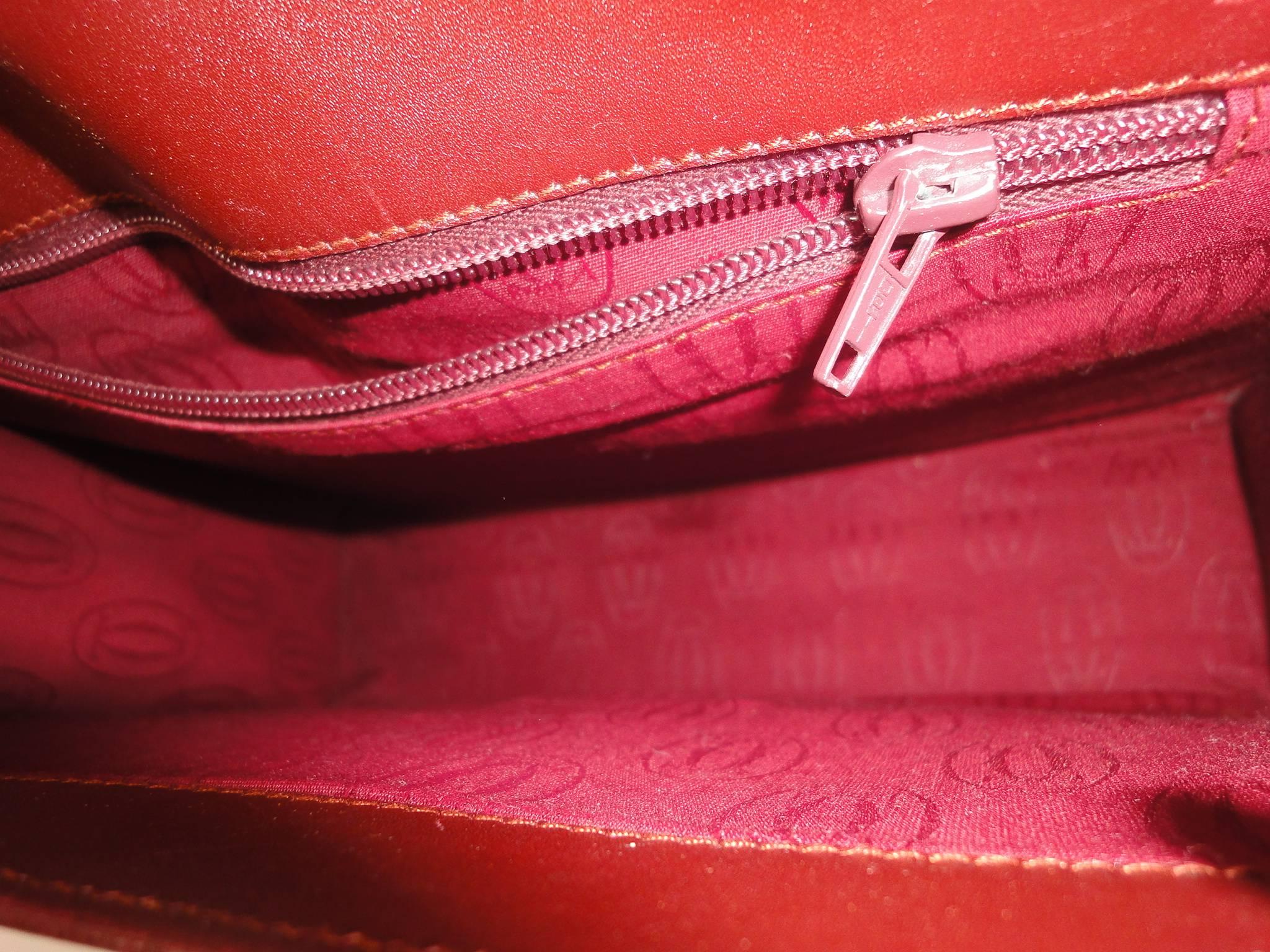 Women's Vintage Cartier kelly style wine leather handbag.  les must de Cartier 