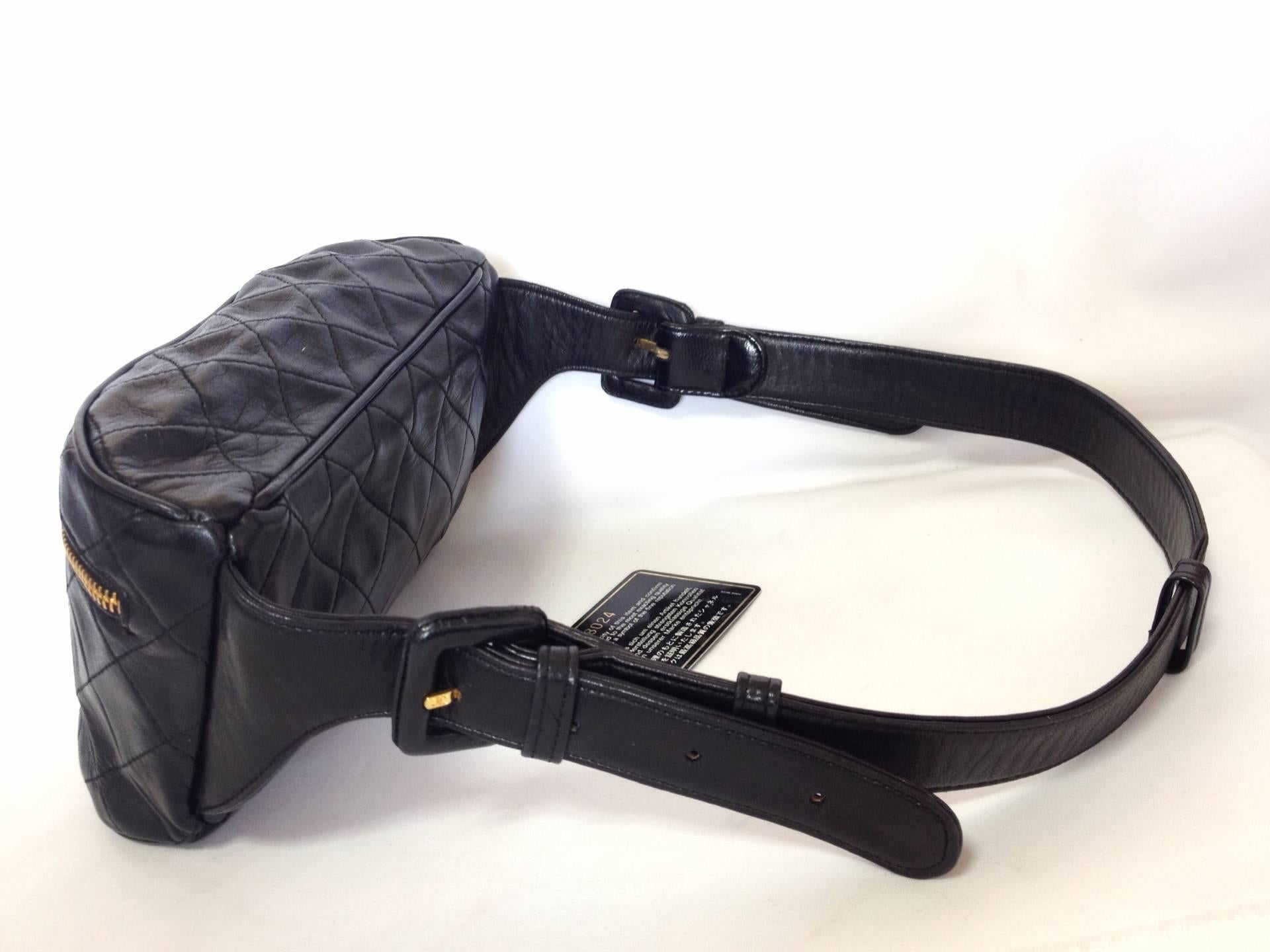 Women's or Men's 1980s Vintage CHANEL black leather waist bag, fanny pack with a detachable belt 