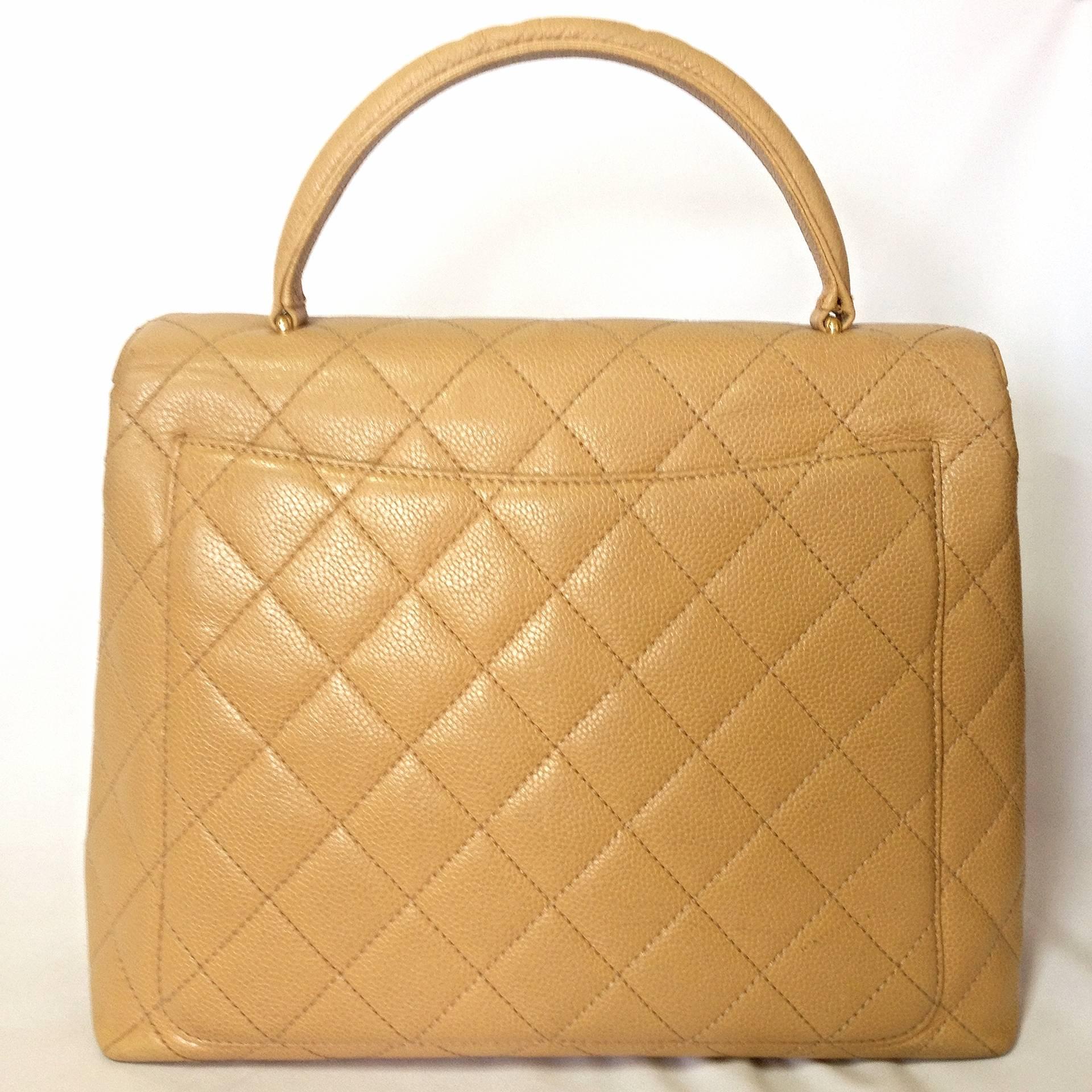 Vintage CHANEL beige brown caviar leather kelly handbag with golden CC closure. Classic large purse. 

Introducing another masterpiece, classic handbag in beige caviar leather from CHANEL back in the 90's. 
One of the most popular and classic