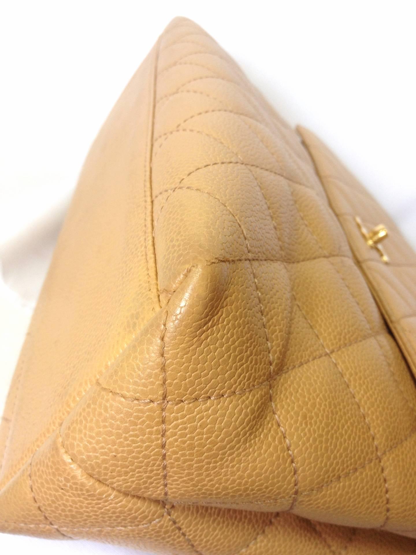 Vintage CHANEL beige brown caviar leather kelly handbag with golden CC closure.  1