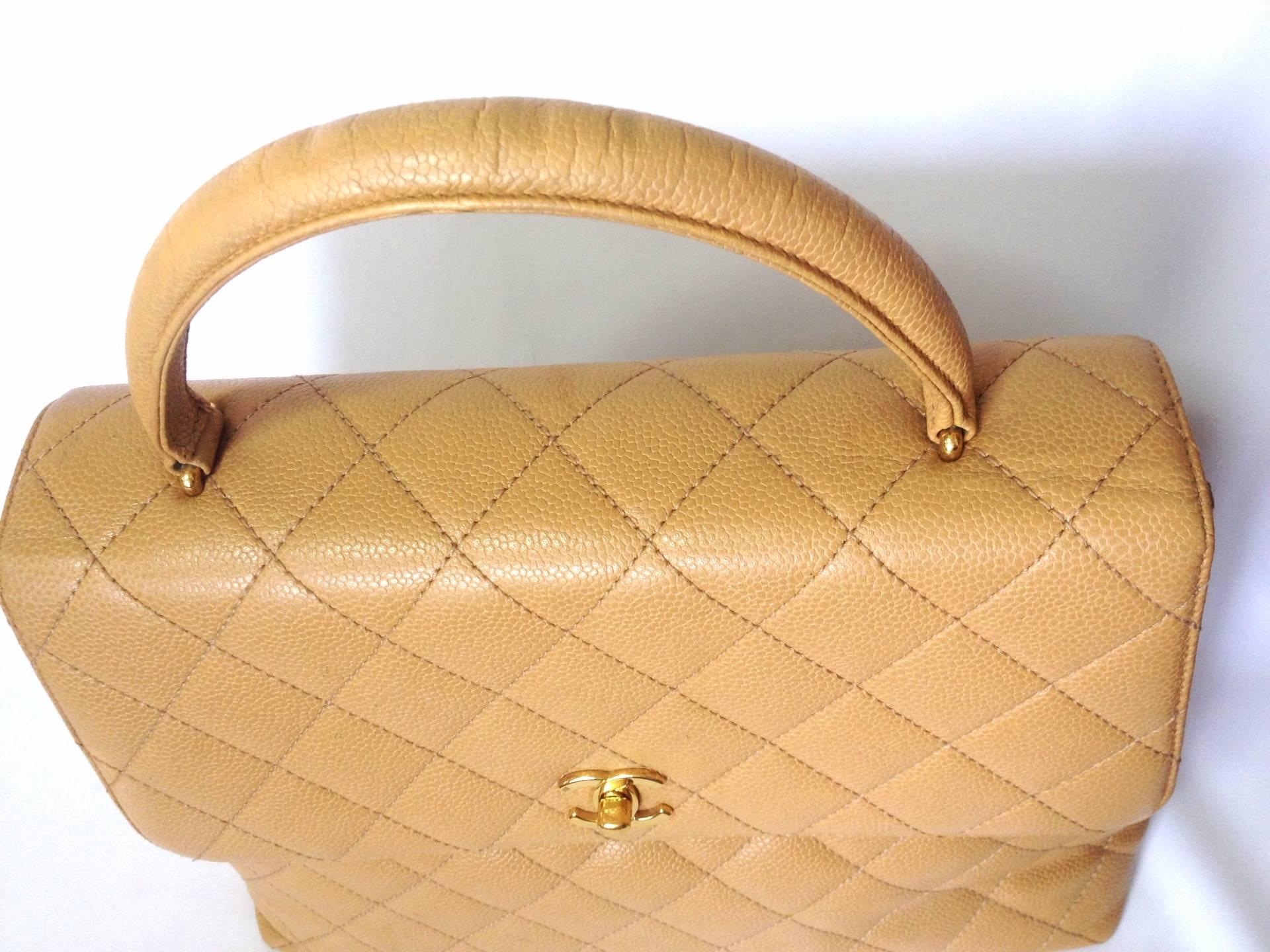 Orange Vintage CHANEL beige brown caviar leather kelly handbag with golden CC closure. 