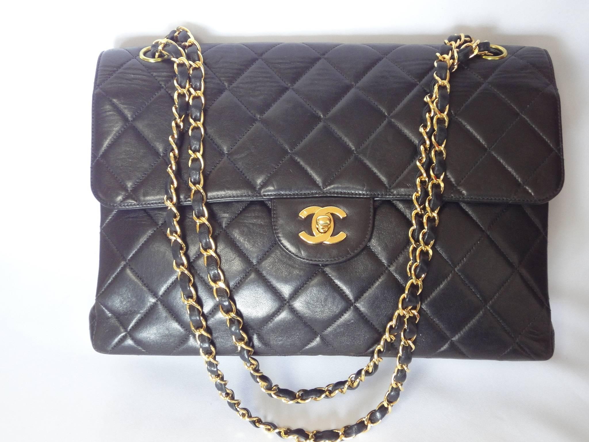 Vintage CHANEL black lambskin 2.55 jumbo, large shoulder bag, double side flap/double side closure flap bag.

Introducing one of the most popular and classic bags from CHANEL back in the 90's. 
Black jumbo/large size double chain 2.55 style