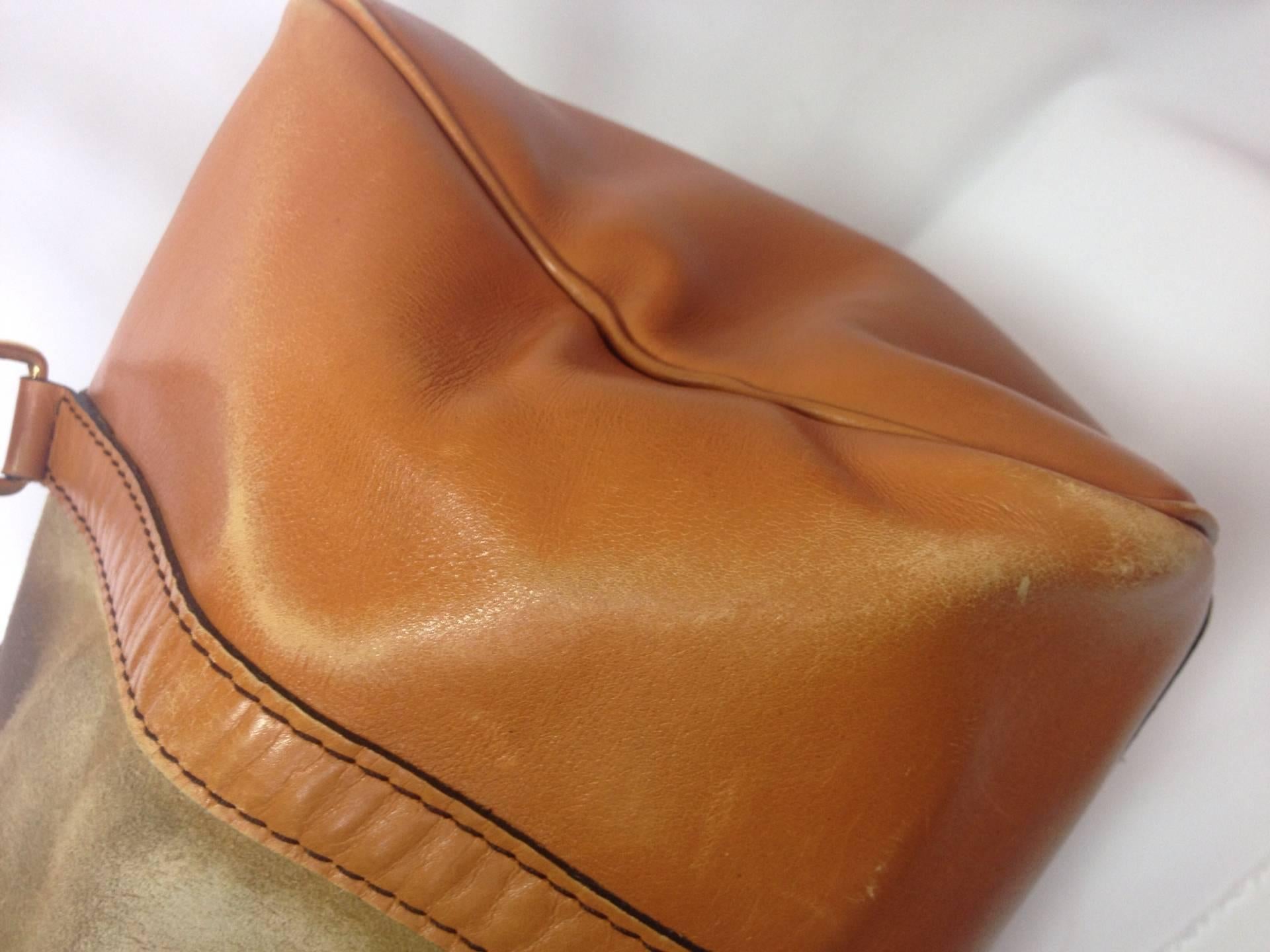 Orange 1970s Christian Dior Bagages camel brown mini duffle purse. Unisex bag