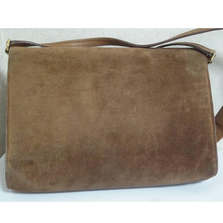 Vintage Gucci tanned brown suede leather shoulder clutch purse with golden logo turn-lock motif. Rare, Collectible Masterpiece

This is a vintage tanned brown genuine suede leather shoulder purse from Gucci.
If you are a vintage Gucci collector