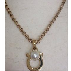 Vintage Salvatore Ferragamo white faux pearl and golden gancini necklace.