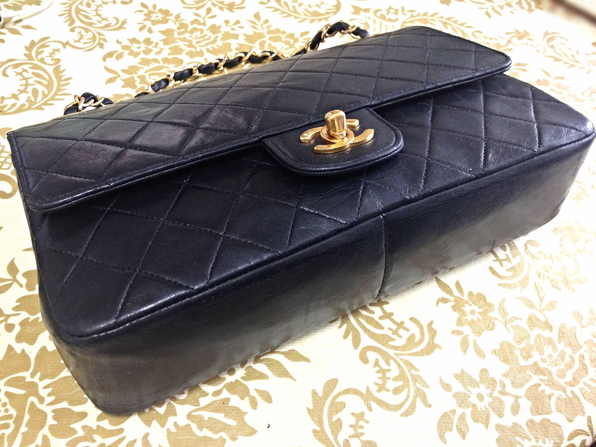 Women's 1980's vintage Chanel black 2.55 classic double flap bag with golden chain strap
