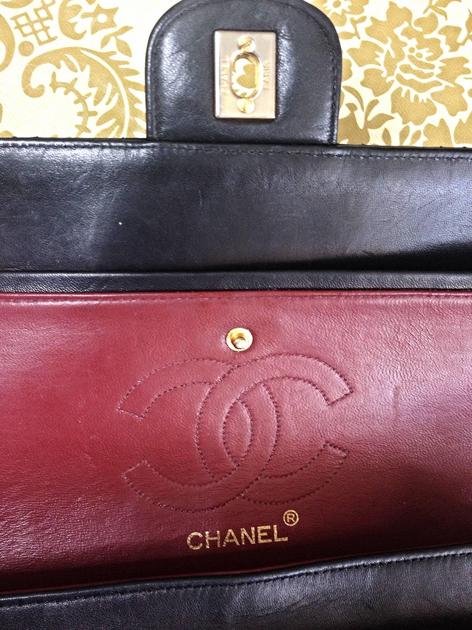 1980's vintage Chanel black 2.55 classic double flap bag with golden chain strap 1
