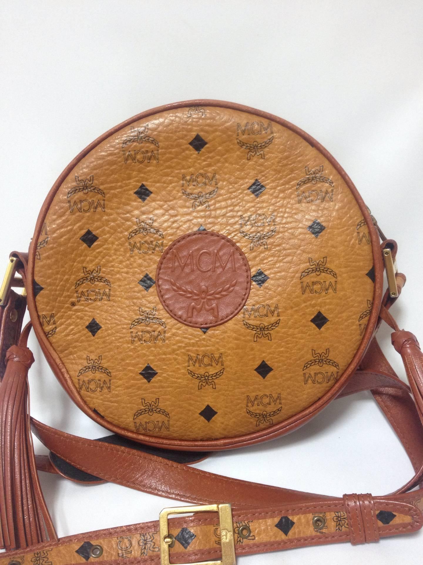 Vintage MCM rare brown monogram round shape shoulder bag with brown leather trimmings. Designed by Michael Cromer. Masterpiece. Unisex use.

MCM has been back in the fashion trend again!!
Now it's considered to be one of the must-have designer in