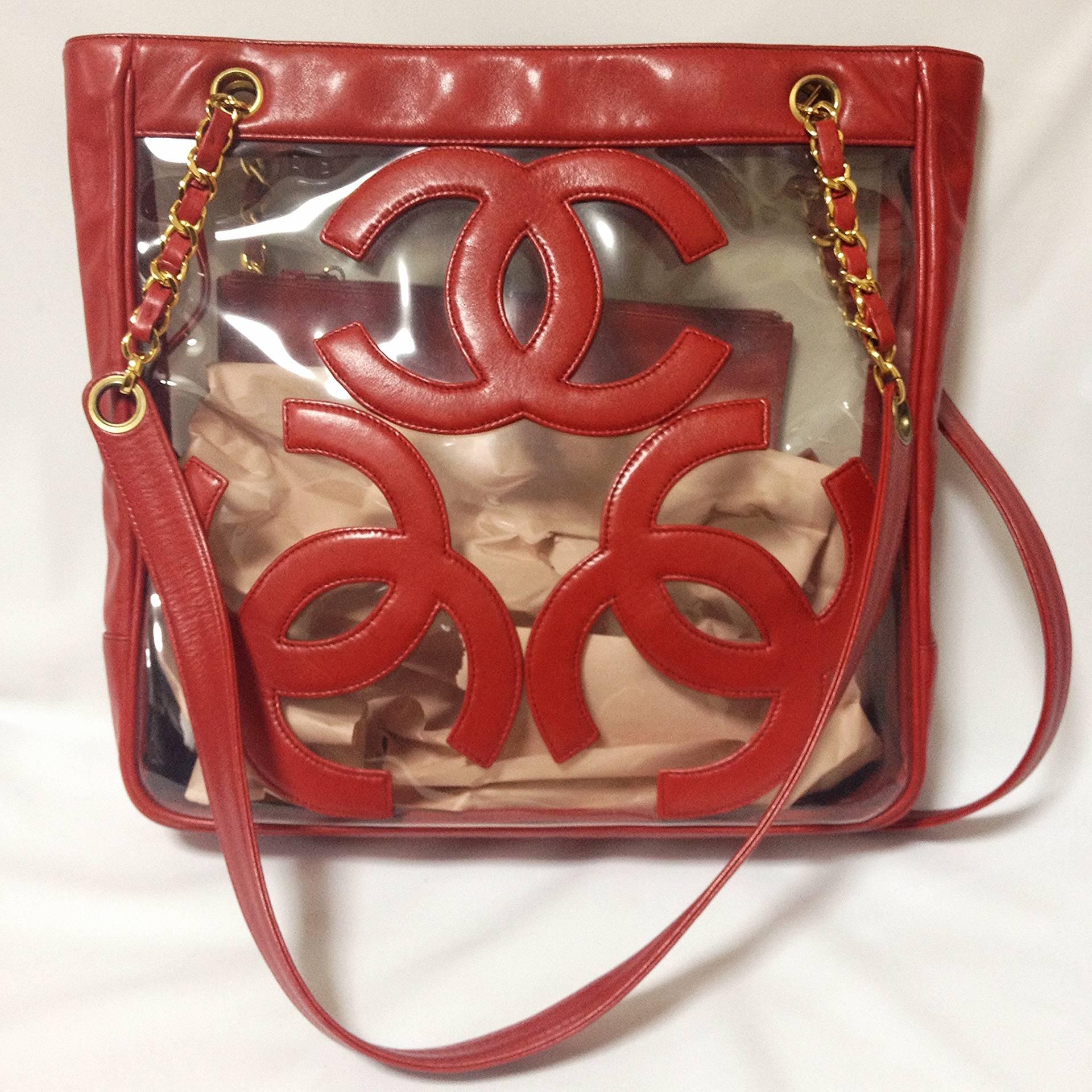 Vintage CHANEL clear vinyl and red leather combination shoulder purse, tote with CC marks and matching pouch. Golden chain.

****The navy version is also available! ****

If you are looking for a vintage CHANEL in classic style but something a