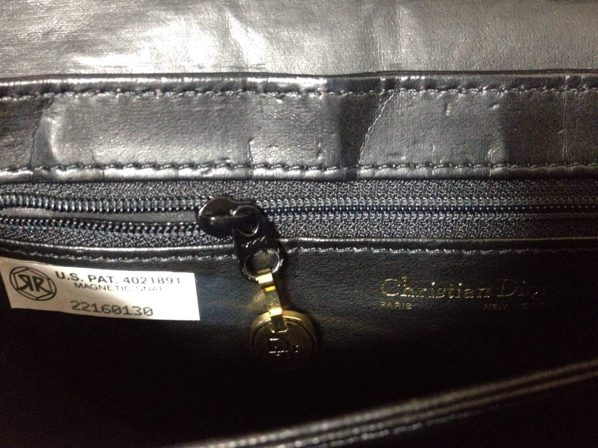 Women's Vintage Christian Dior Vintage black leather clutch purse, mini bag, with chain.