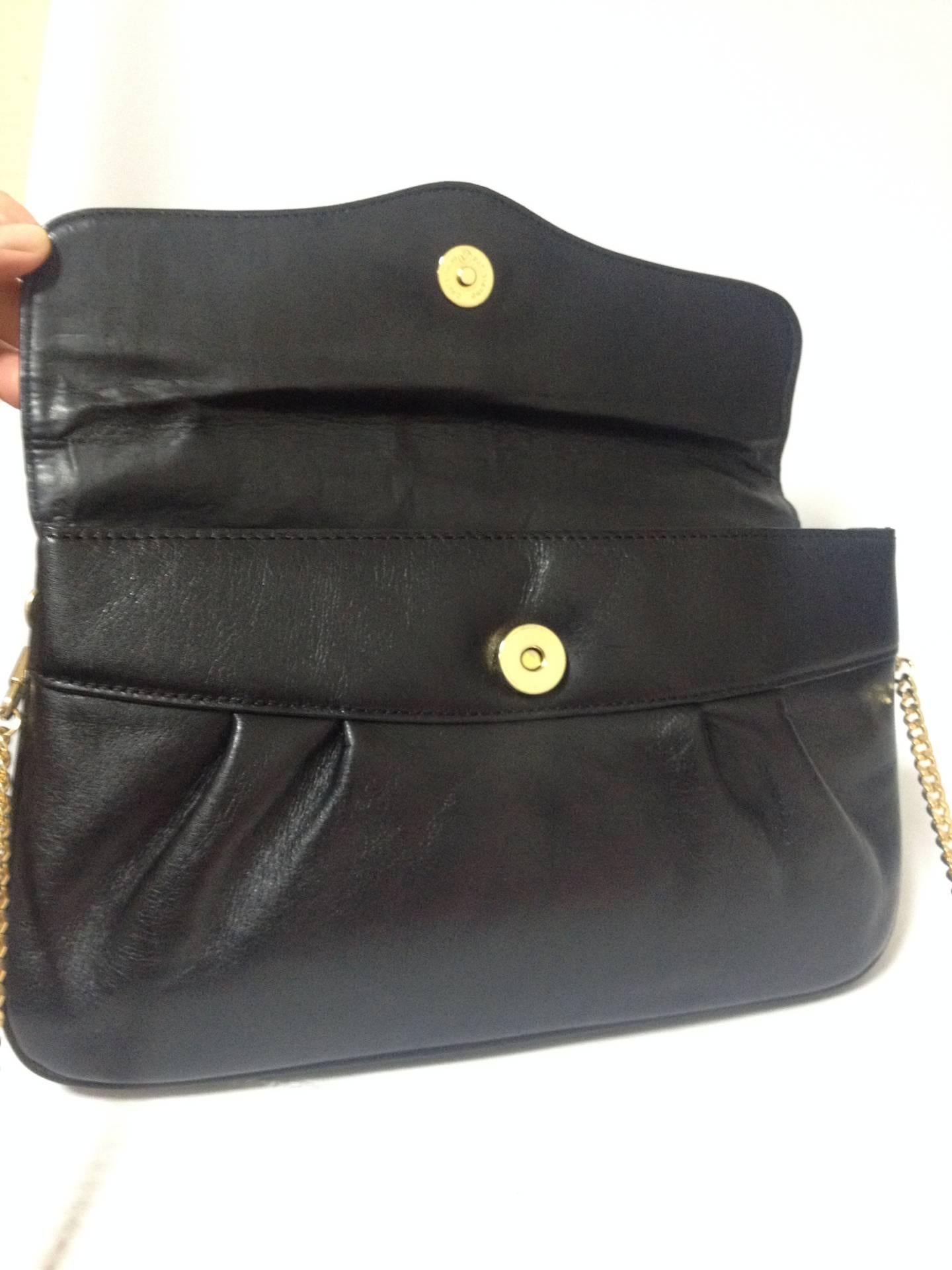 Black Vintage Christian Dior Vintage black leather clutch purse, mini bag, with chain.