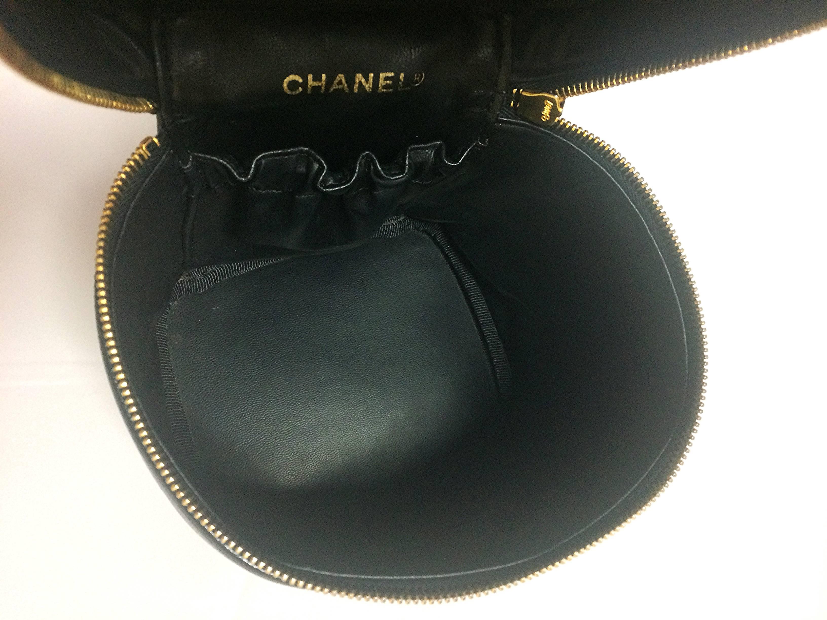 Women's Vintage CHANEL black caviar cosmetic and toiletry mini bag, party vanity bag.