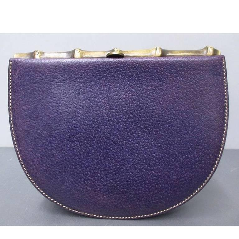 Vintage MOSCHINO purple pigskin oval shape clutch bag with bamboo style kiss lock closure. Masterpiece produced by Red Wall.

This is a cute vintage purple leather clutch purse with rust gold tone bamboo shape kiss lock closure.

You will also