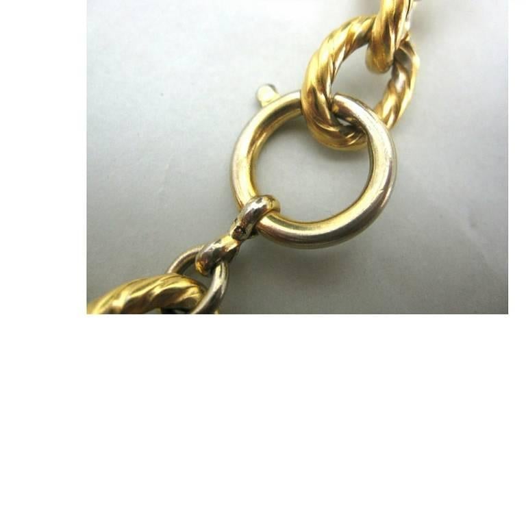 Women's Vintage Salvatore Ferragamo statement necklace with golden round coin shoe charm