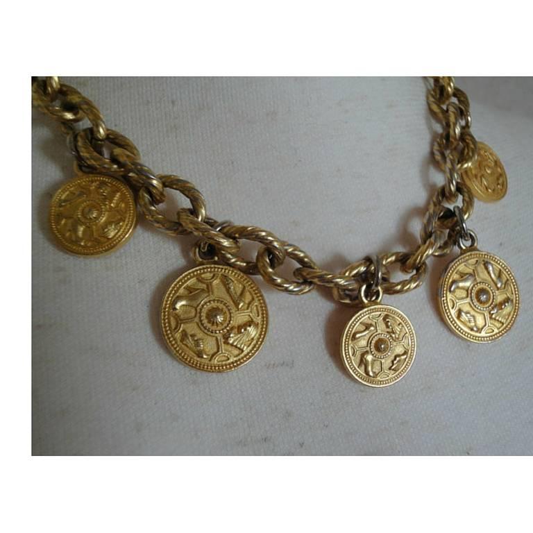 Vintage Salvatore Ferragamo statement necklace with golden round coin charms of shoes and chain. Gorgeous jewelry.

Here is another fabulous piece from Salvatore Ferragamo back in the era.
Featuring 5 round charms of Ferragamo's shoe motifs.
The