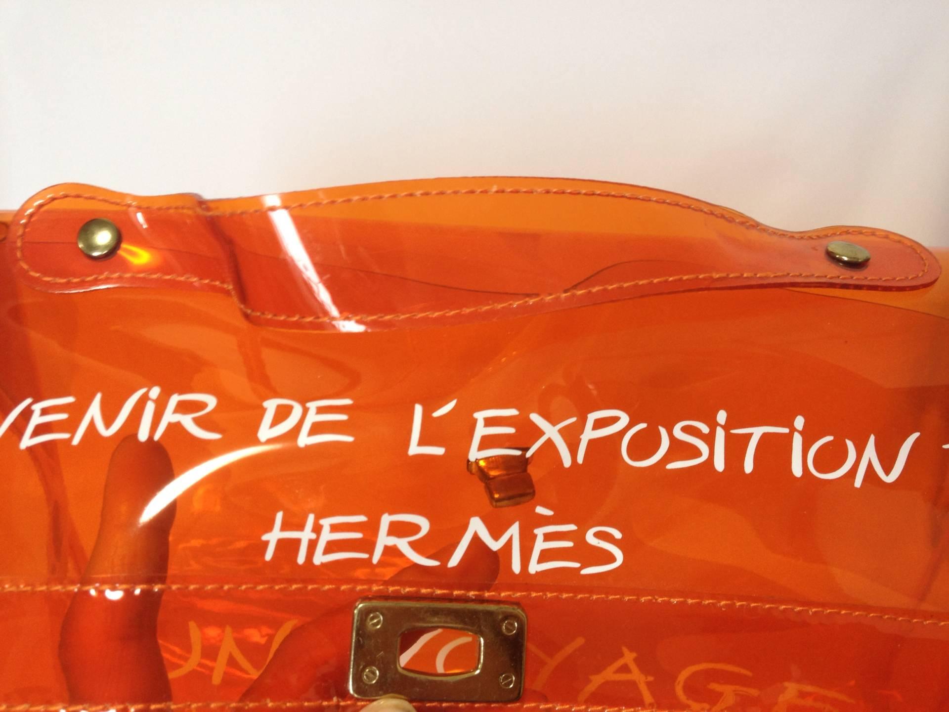 Women's or Men's MINT condition. Hermes a rare transparent Vintage orange vinyl Kelly bag