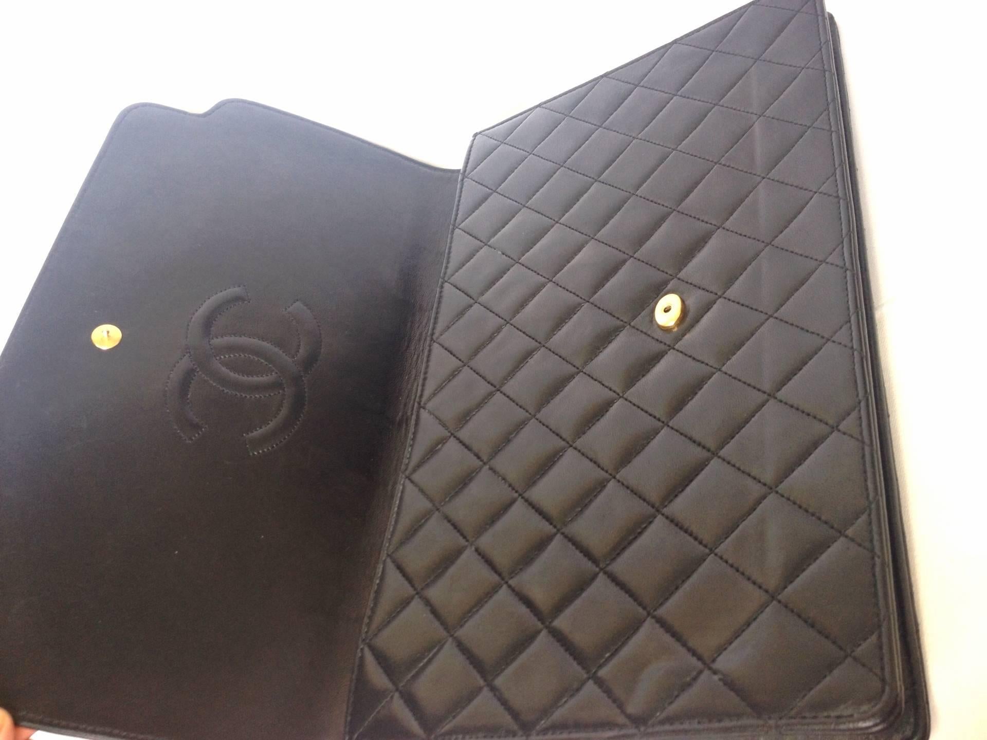 Women's or Men's Vintage CHANEL classic black quilted lambskin document clutch purse. Classic bag