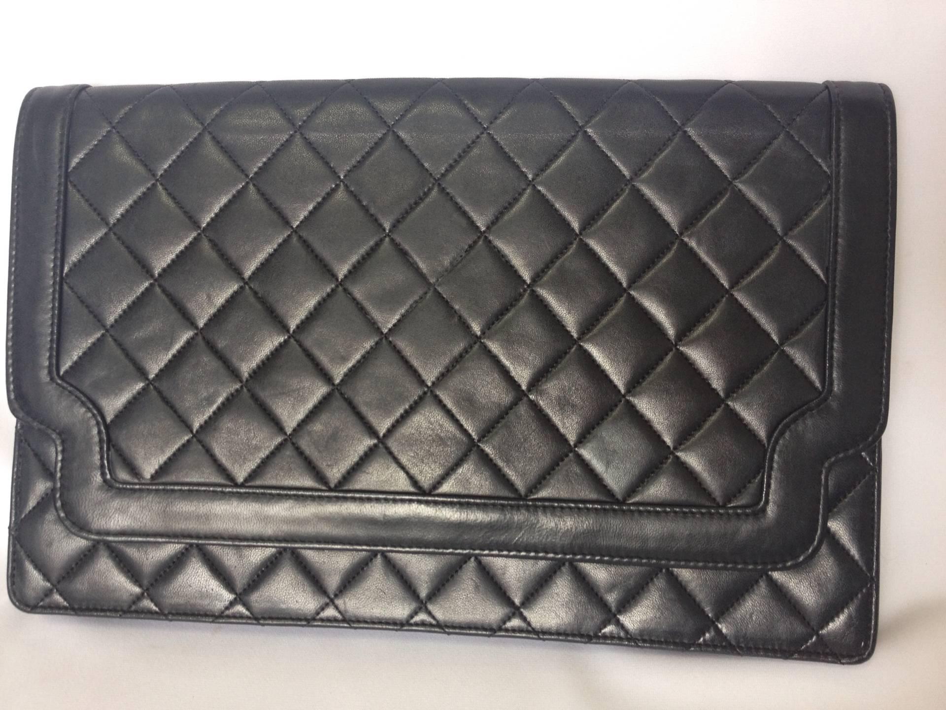 Vintage CHANEL classic black quilted lambskin document clutch purse with unique shape flap. Unisex style pouch, daily use, party bag

This is a hard-to-find vintage piece from Chanel from the early 90's. Classic document, clutch purse with