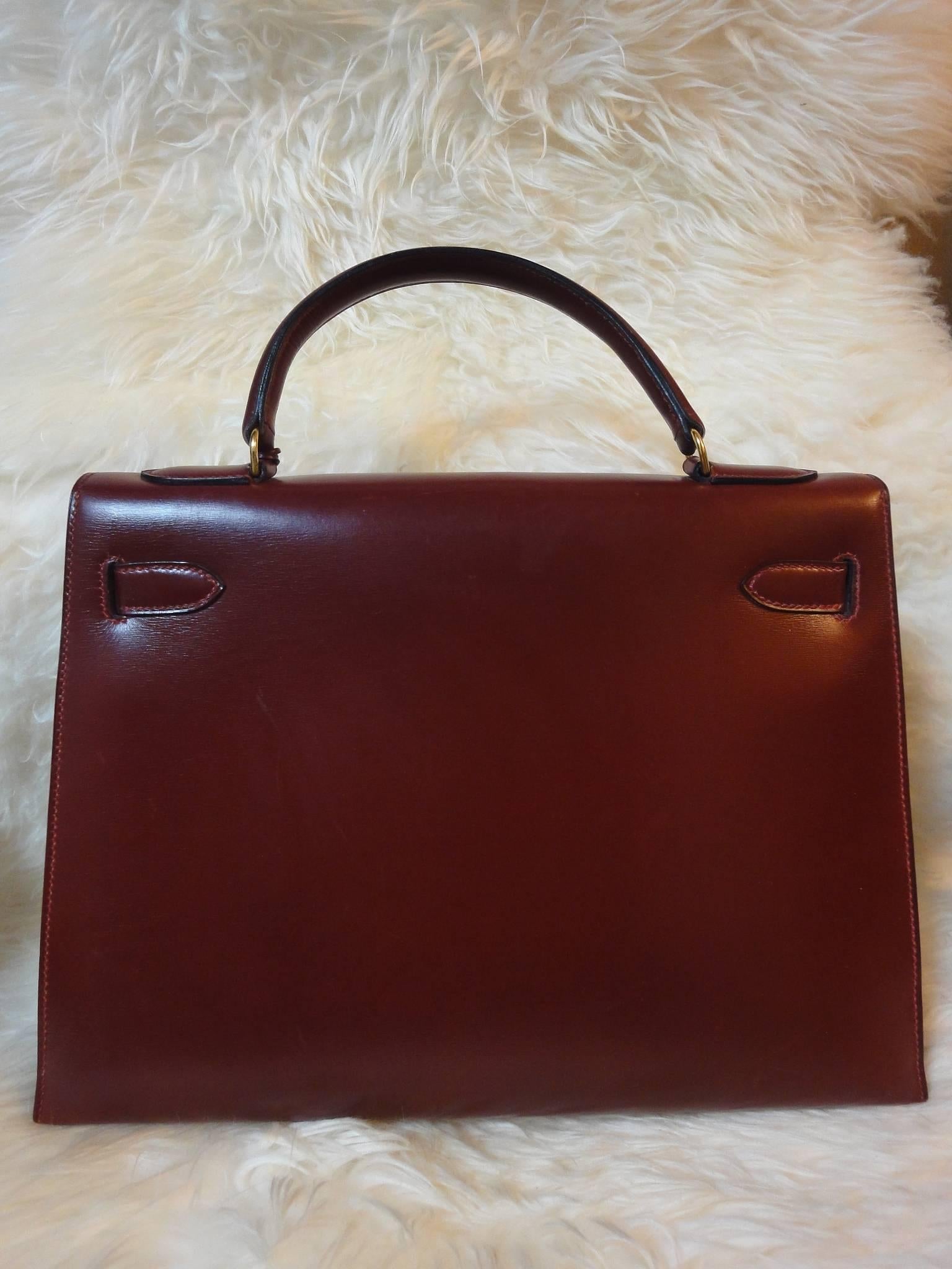 1980s Vintage HERMES Kelly 32 bag rouge ash box calf leather with gold hardware. Exterior stitch. Stamp K in O, 1981. Best known classic bag

This is one of the oldest vintage HERMES Kelly bags from 1981 with the ECLAIR zipper in the interior