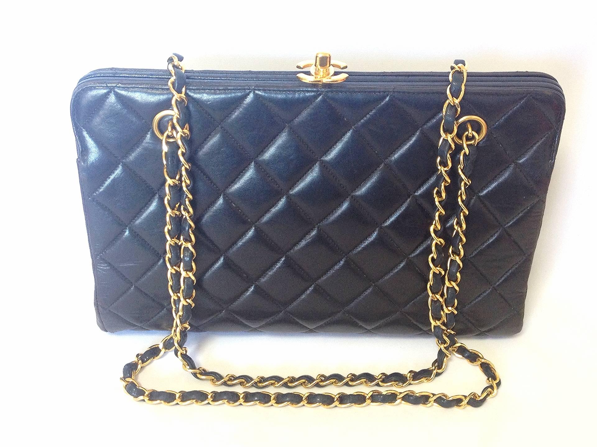 Vintage CHANEL black lambskin golden chain shoulder bag with golden CC kiss lock closure. Rare medium clutch type 2.55 but classic purse.

Introducing another vintage purse from CHANEL back in the 90's....
Rare and unique design black lambskin