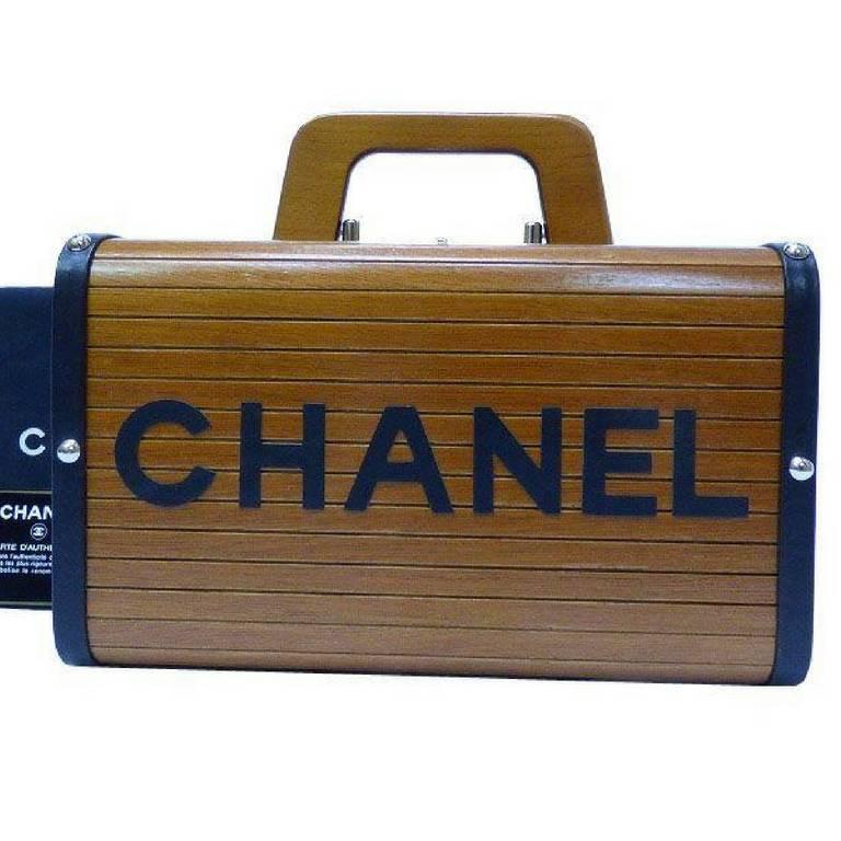 MINT/Almost NEW condition! 
1990s Vintage CHANEL genuine wood handbag, mini trunk case with black CC and logo motif. One-of-a-kind vintage masterpiece from 90's.... 

Beautiful vintage condition!

Here is another masterpiece from CHANEL back in