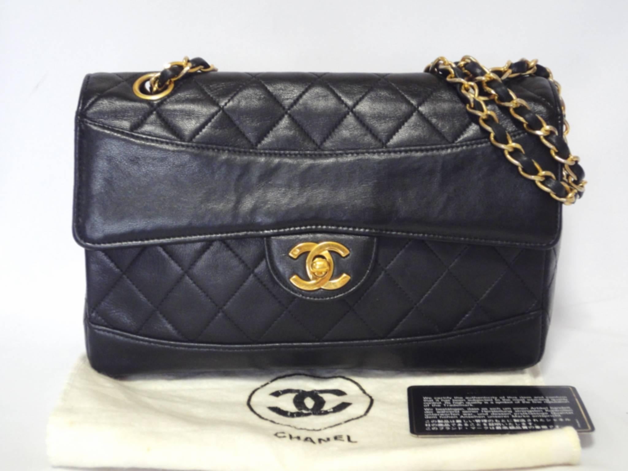 Vintage Chanel classic 2.55 black lambskin shoulder bag with golden chain and unique oval round stitch flap.

If you are a vintage CHANEL lover/collector, then this is a must-have piece for your collection!

Introducing another rare vintage