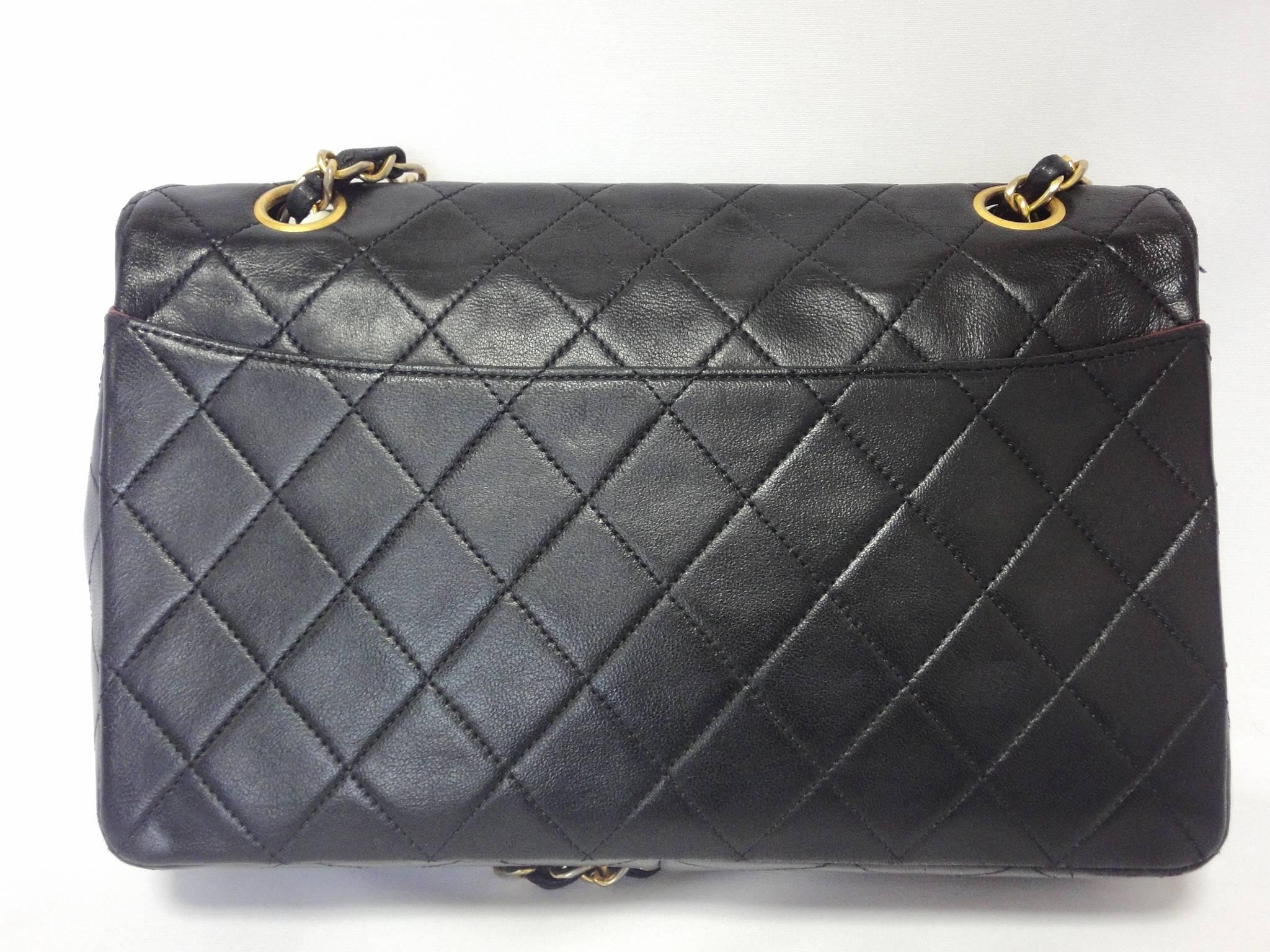 Gray Vintage Chanel classic 2.55 black lambskin shoulder bag with golden chain straps