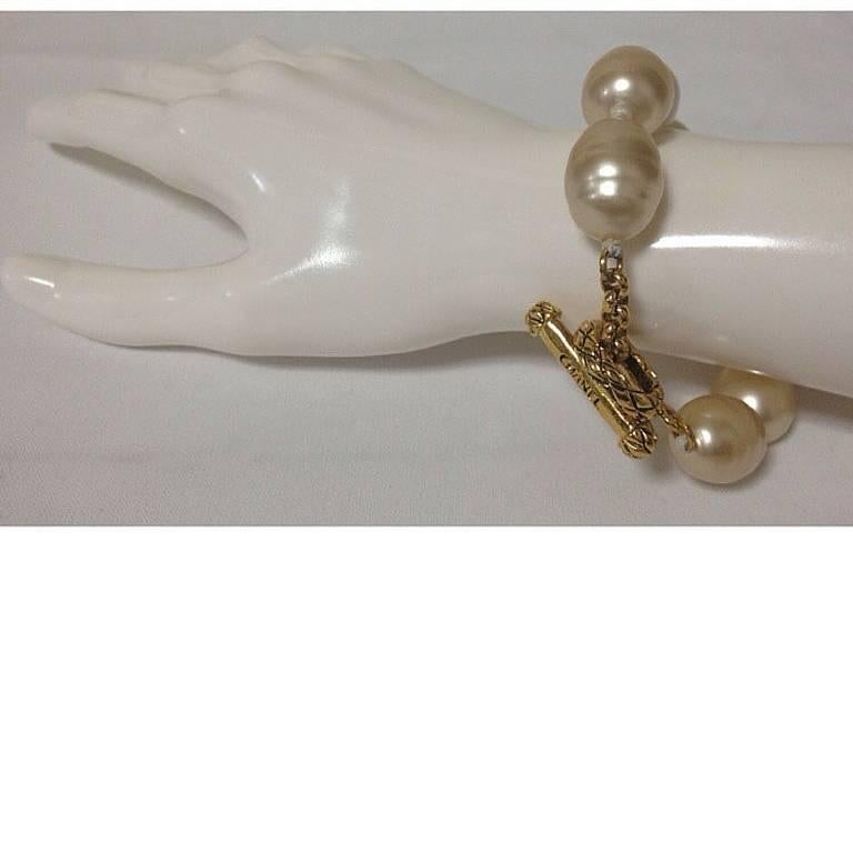 Vintage CHANEL extra large faux baroque pearl bracelet with logo embossed hardware. Rare vintage jewelry from Chanel.

Introducing a Chanel gorgeous bracelet made out of extra large faux baroque pearls in white.
So chic and CHANEL! Great as a