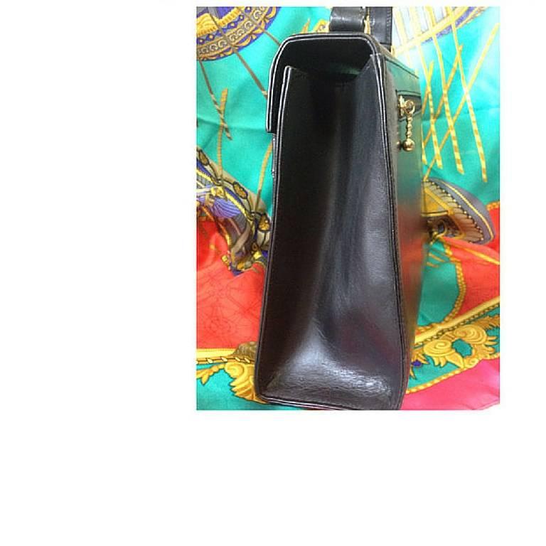 Black Vintage Gianni Versace black leather Kelly style bag with golden buckle closure  For Sale
