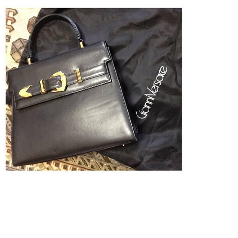 Vintage Gianni Versace black leather Kelly style bag with golden buckle closure  For Sale 1